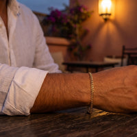 Thumbnail for Maghrebin man wearing His gold cuban Heart Bond bracelet, Marrakech rooftop dusk