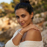 Thumbnail for Freshwater Pearl Bracelet worn by a woman outdoors, showcasing its elegance and unique pearls, by Brother & Sisters.