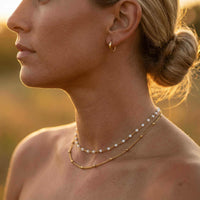 Thumbnail for Double Layer Choker featuring white enamel beads and gold satellite chain by Brother & Sisters, layered elegance.