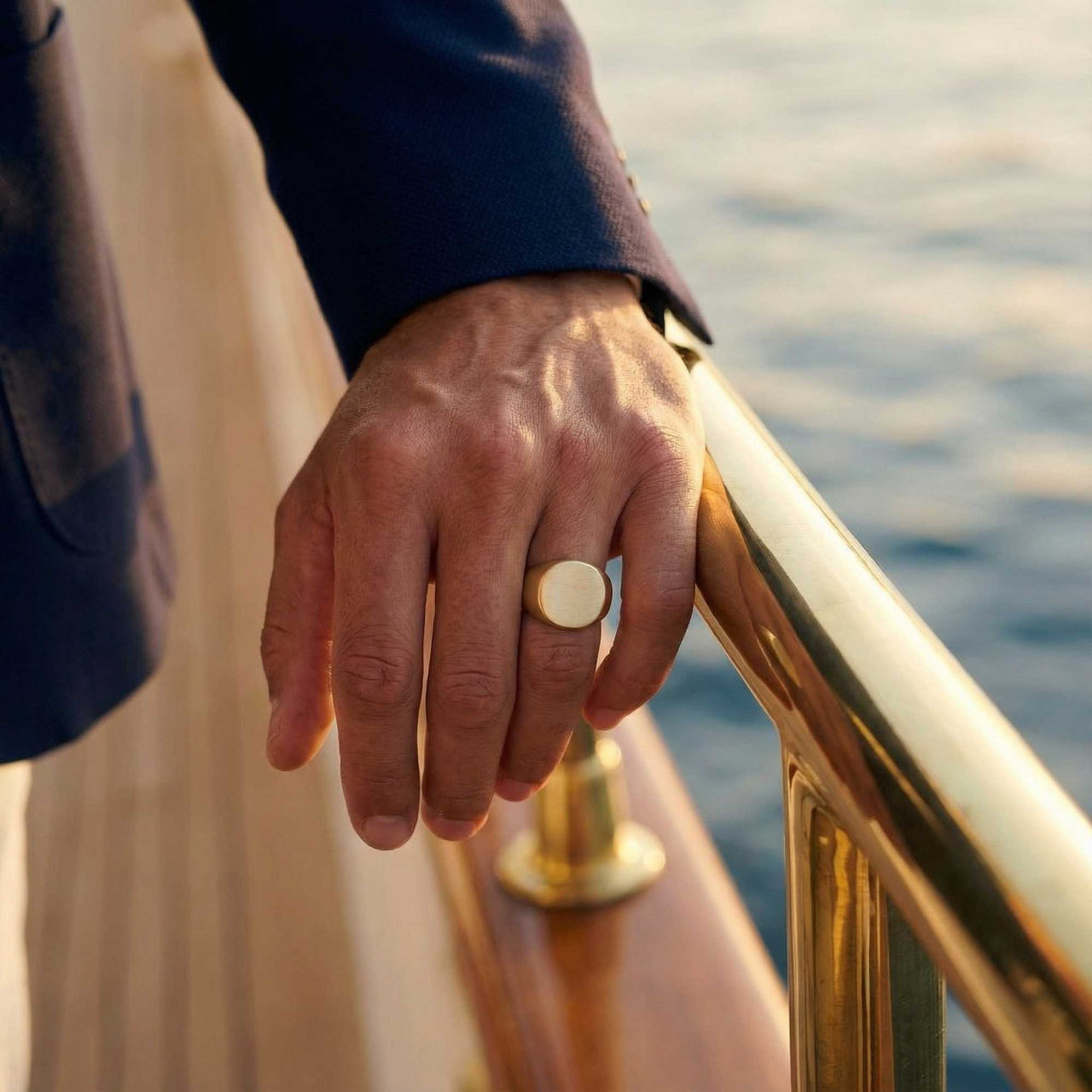 Oval Ring worn close-up — bold 15mm wide mens statement ring in rose gold, sleek modern design