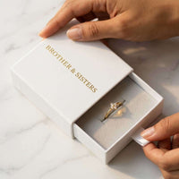 Thumbnail for Crystal Flower Ring in a Brother & Sisters gift box, showcasing its delicate design and sparkling zirconia stones.