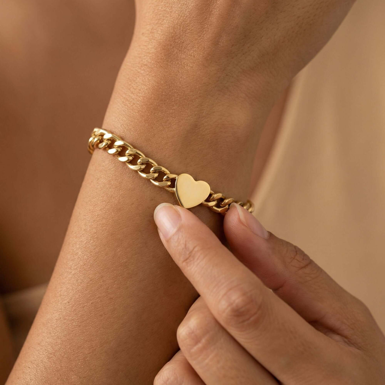 Love Couple Bracelet featuring a polished heart on a bold Cuban link chain by Brother & Sisters.