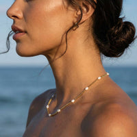 Thumbnail for Dainty Pearl Choker worn by a model, featuring tiny freshwater pearls on a delicate gold chain by Brother & Sisters.