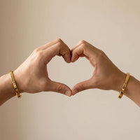 Thumbnail for Matching Couple Bracelet by Brother & Sisters, showing hands forming a heart with engraved bracelets.