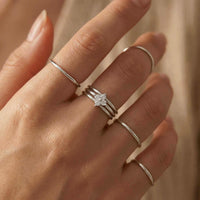 Thumbnail for Crystal Flower Ring with delicate band and sparkling zirconia stones on a hand by Brother & Sisters.