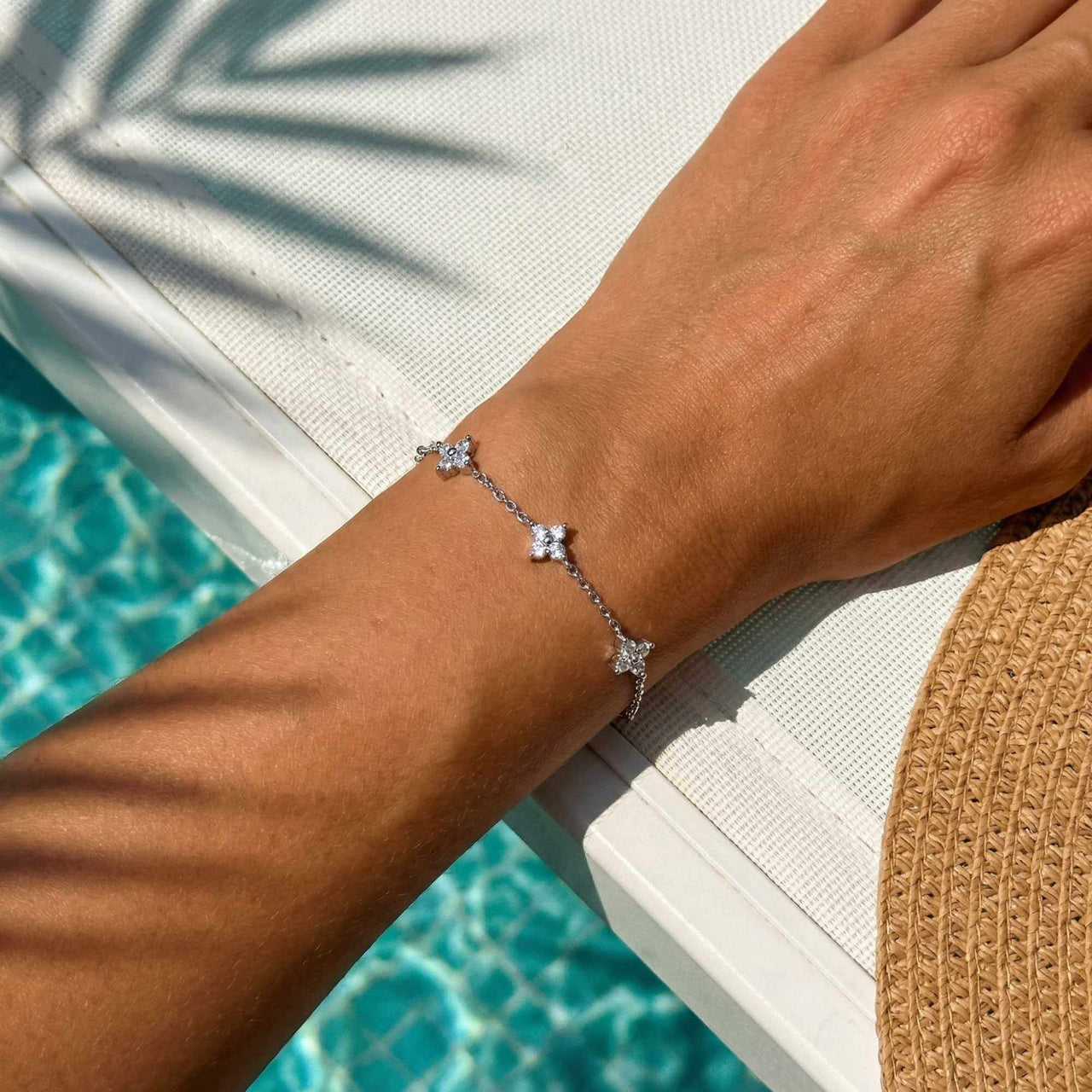 Crystal Flower Bracelet featuring five delicate crystal flowers on a fine chain by Brother & Sisters.