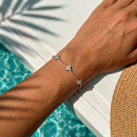Thumbnail for Crystal Flower Bracelet featuring five delicate crystal flowers on a fine chain by Brother & Sisters.