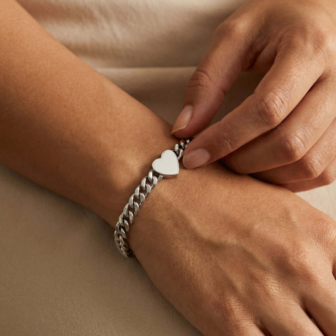 Love Couple Bracelet featuring a polished heart on a Cuban link chain by Brother & Sisters.