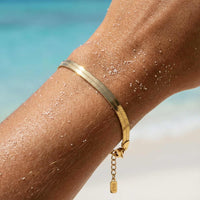 Thumbnail for Kauai Herringbone Bracelet by Brother & Sisters, showcasing a sleek herringbone chain with 18K gold PVD coating.