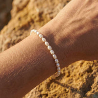 Thumbnail for Freshwater Pearl Bracelet by Brother & Sisters, showcasing unique pearls on a wrist, capturing summer vibes.