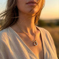Thumbnail for The Unity Bond necklace by Brother & Sisters showcases a polished silver circle and gold bar in elegant harmony.