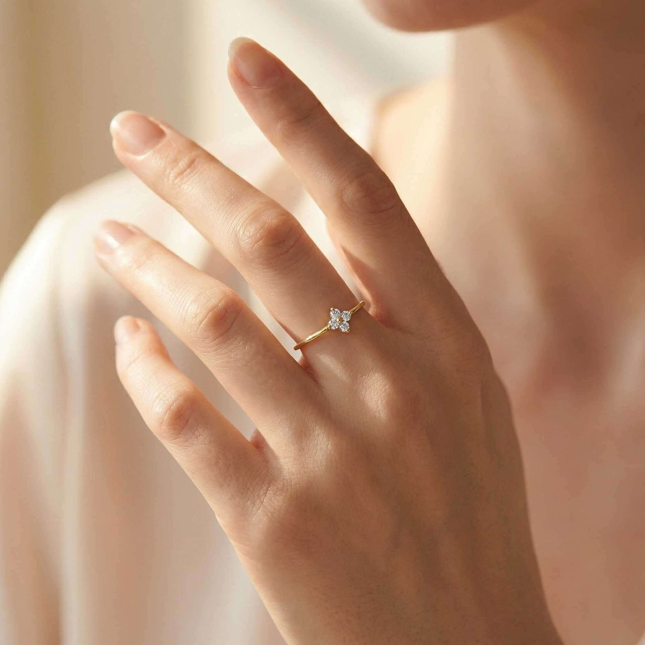Crystal Flower Ring by Brother & Sisters, featuring a delicate design with zirconia stones, worn on a finger.