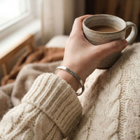 Thumbnail for Matching Couple Bracelet featured on a cozy sweater-clad wrist, holding a coffee cup, by Brother & Sisters.
