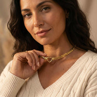 Thumbnail for Vali Heart Choker Necklace worn by a woman featuring a chunky Cuban chain and delicate heart, by Brother & Sisters.
