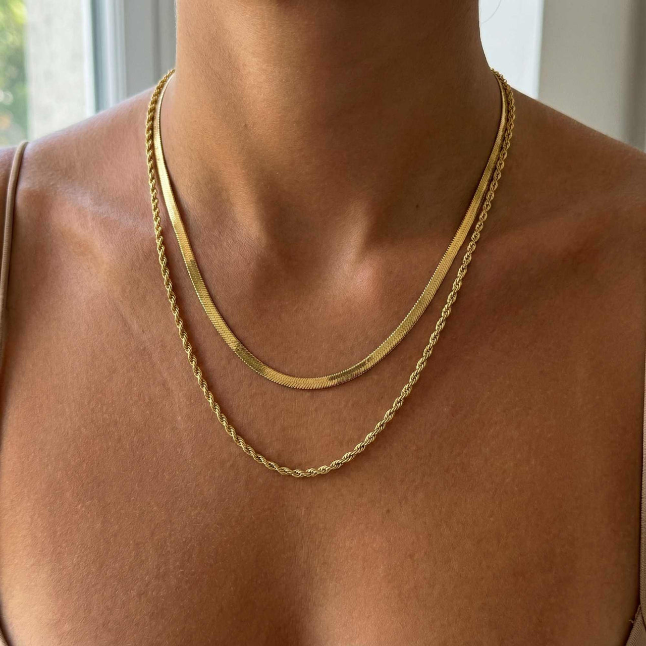 The Double Luxe necklace by Brother & Sisters featuring a herringbone and rope chain for effortless layering.