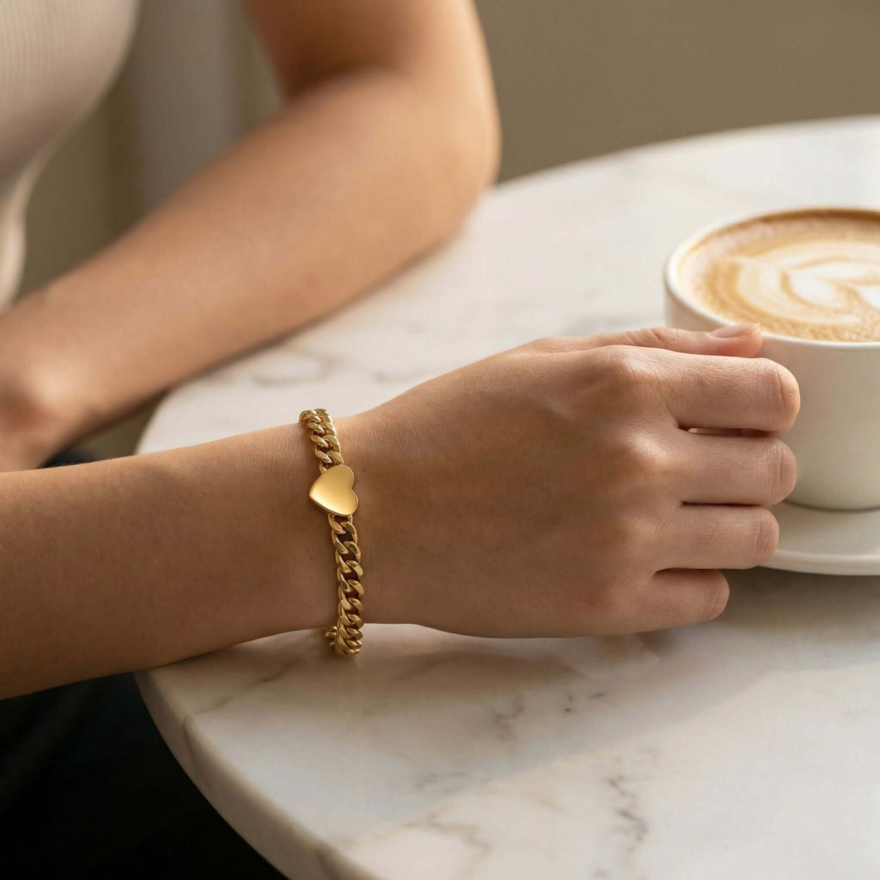 Love Couple Bracelet by Brother & Sisters featuring a polished heart on a Cuban link chain.