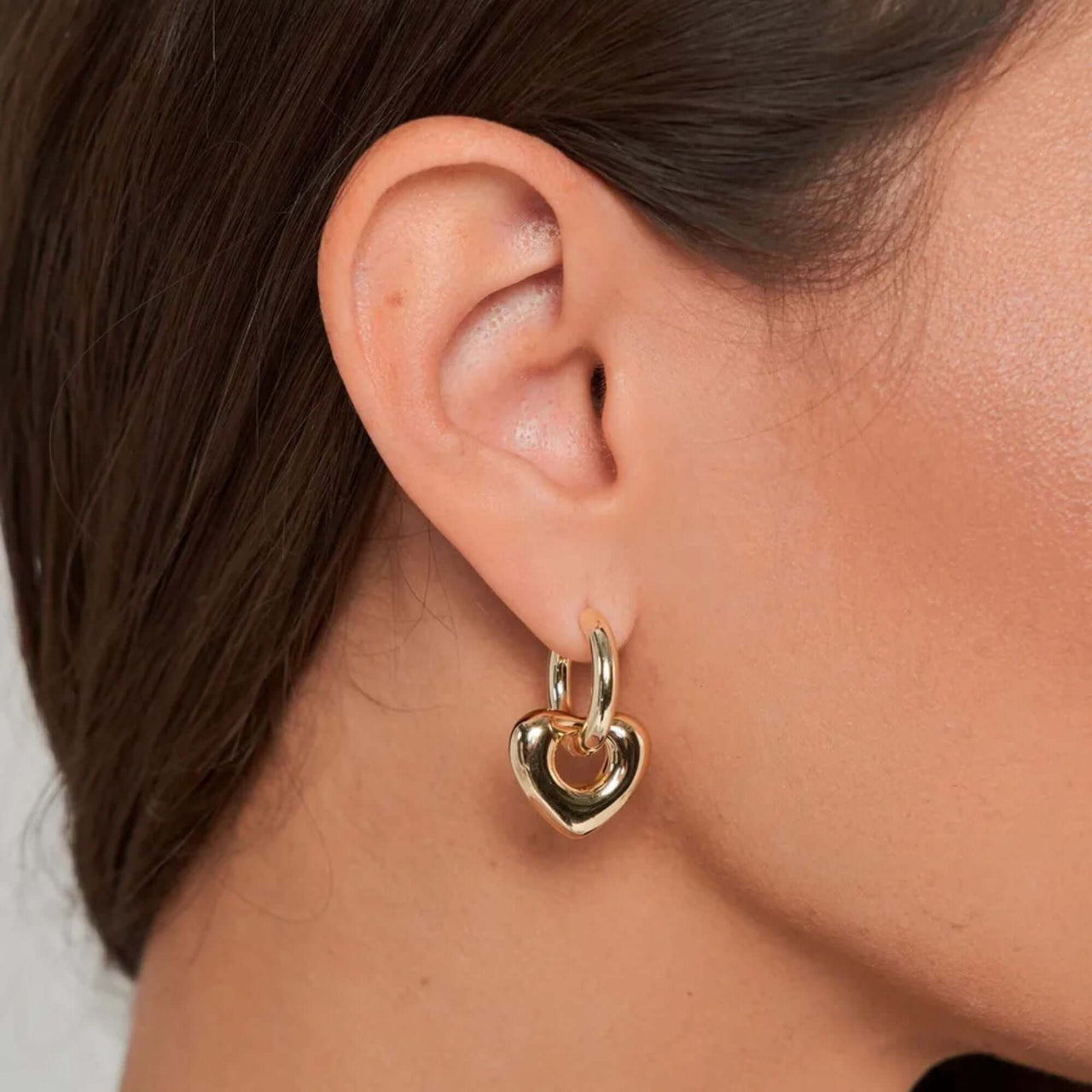 Aurora Heart Hoops earrings by Brother & Sisters, featuring a gold heart design perfect for any outfit.