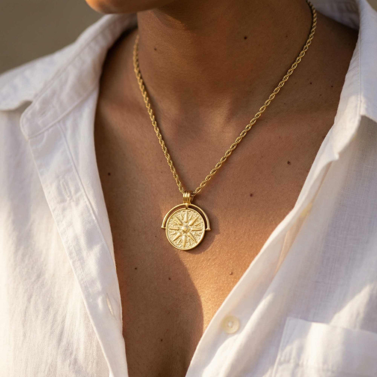Golden Sun Necklace worn by a model, featuring a textured sun medallion on a classic rope chain by Brother & Sisters.