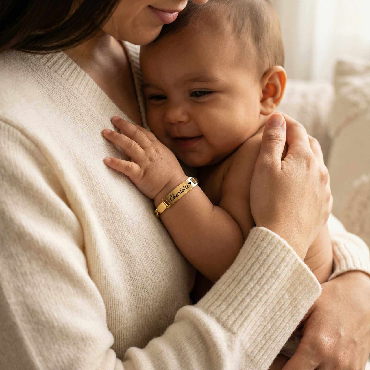Infant Bracelet on baby, personalized keepsake by Brother & Sisters, capturing a tender moment.