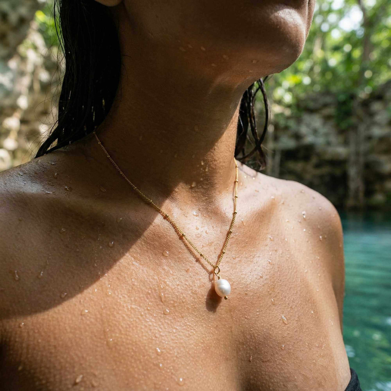 Pearl Drop Necklace by Brother & Sisters, featuring an 8mm freshwater baroque pearl on a waterproof chain.