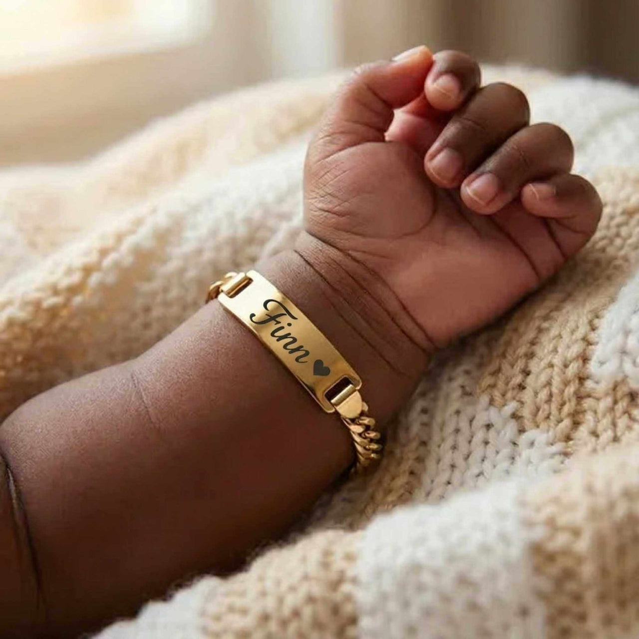 Infant Bracelet featuring personalized name 'Finn' by Brother & Sisters, elegant keepsake for newborns.