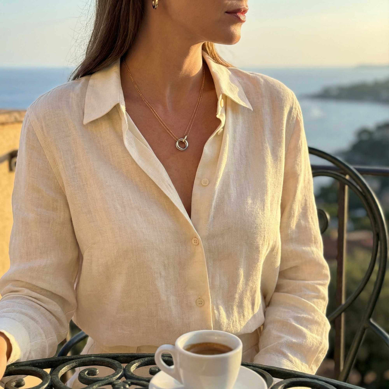 The Unity Bond necklace by Brother & Sisters featured with warm gold bar and polished silver circle.