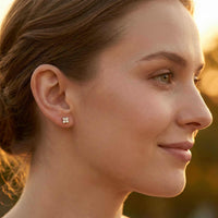 Thumbnail for Crystal Flower Stud Earrings by Brother & Sisters, showcasing tiny four-leaf flowers with zirconia sparkle.