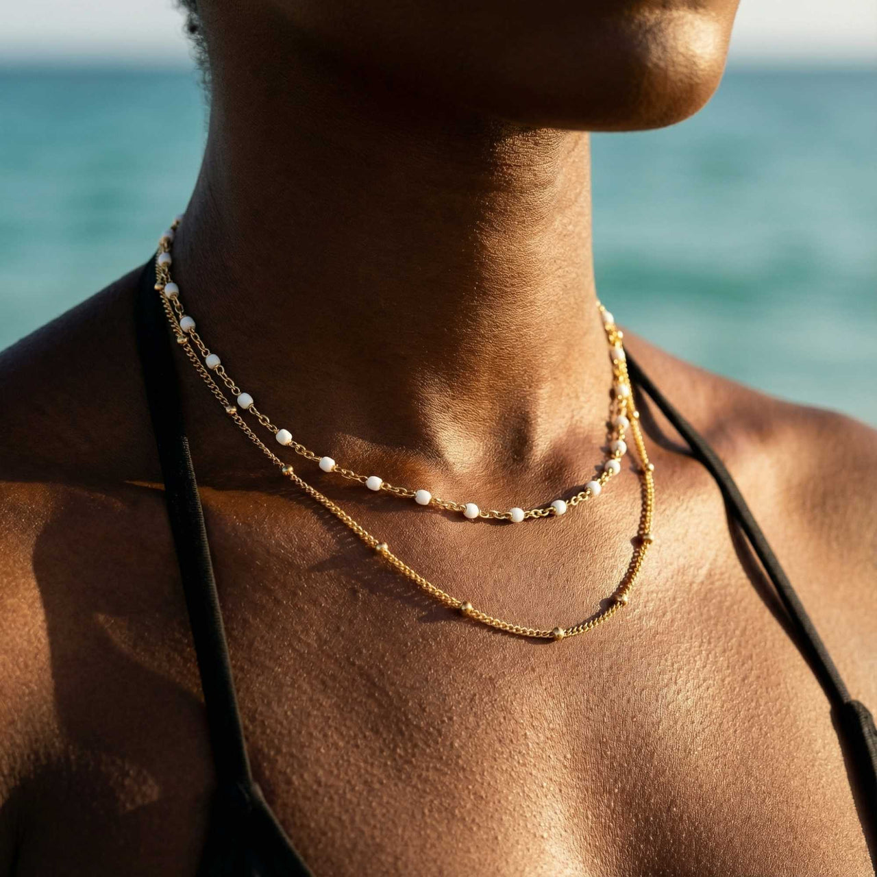 Double Layer Choker featuring gold and white enamel beads by Brother & Sisters, perfect layered look for any occasion.
