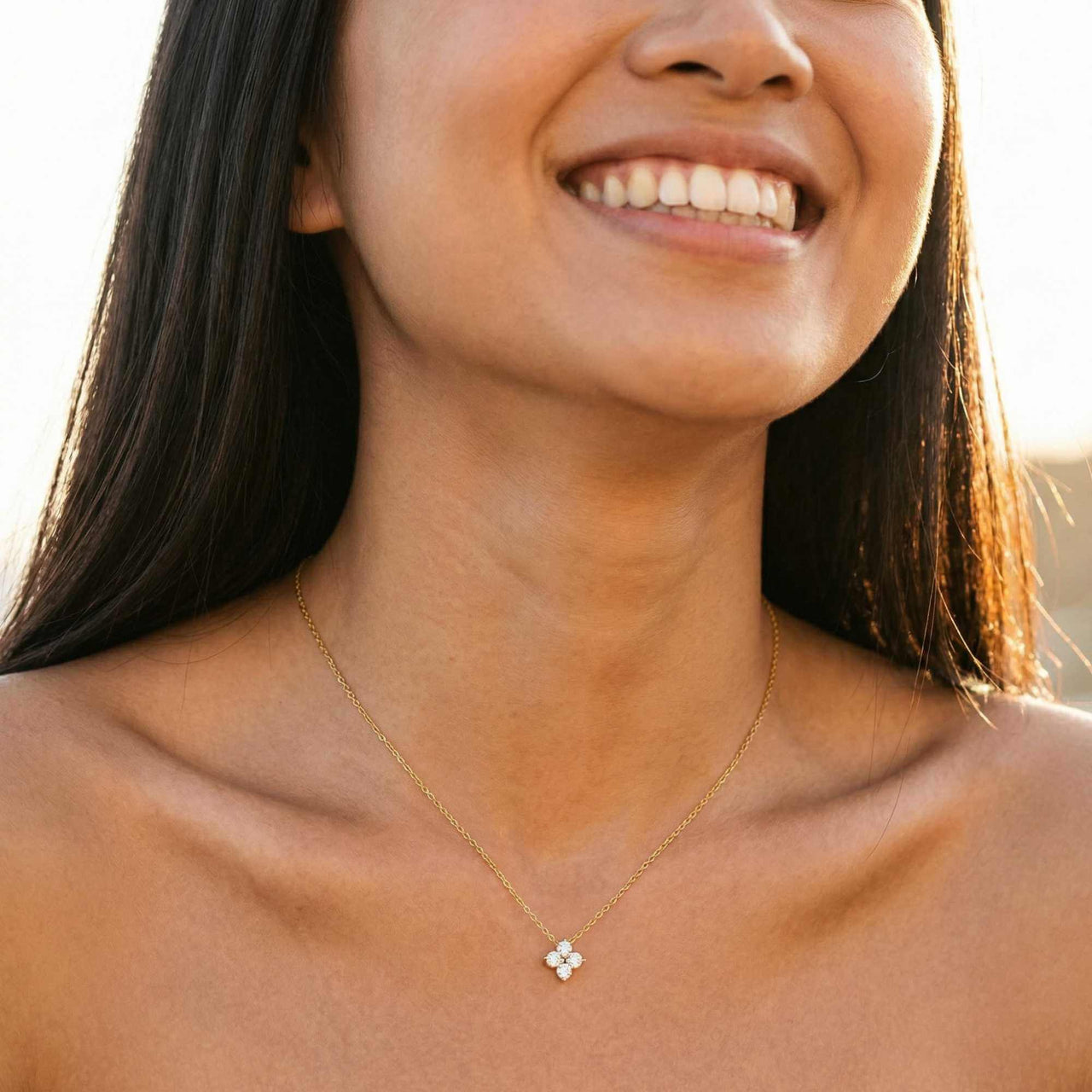 Crystal Flower necklace dainty signature pendant featuring four sparkling zircon crystals in flower setting