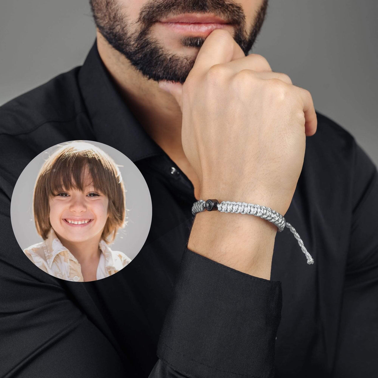 Man Grey Photo Bracelet worn by a man, showcasing a personalized photo pendant with a child's picture, by Brother & Sisters.