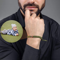 Thumbnail for Man Olive Photo Bracelet worn by a man, featuring a circular photo pendant with a child's image, by Brother & Sisters.