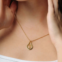 Thumbnail for Birth Flower Name Necklace from Brother & Sisters, showcasing a gold pendant with flower design on a gold chain.