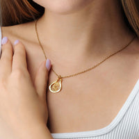 Thumbnail for Close-up of a woman wearing a Birth Flower Name Necklace by Brother & Sisters, featuring a gold charm.