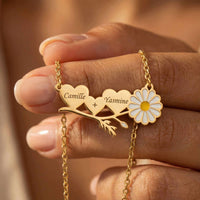 Thumbnail for Daisy Name Necklace featuring engraved hearts and a white enamel daisy by Brother & Sisters.