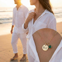 Thumbnail for Precious Name Necklace worn by a couple on the beach, featuring engraved initials and a birthstone crystal, by Brother & Sisters.