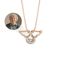 Thumbnail for Angel Photo Necklace with angel wings design by Brother & Sisters, featuring a sparkling centerpiece for cherished memories.