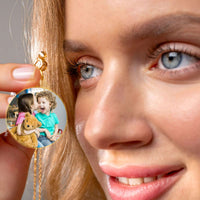 Thumbnail for Woman wearing an Angel Photo Necklace with kids’ photo, personalized jewelry by Brother & Sisters.