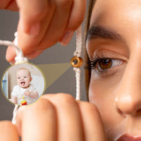 Thumbnail for White Photo Bracelet with a personalized photo of a smiling baby on a woman's wrist, by Brother & Sisters.