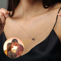 Thumbnail for Circular Photo Necklace featuring a customizable photo projection by Brother & Sisters worn on a woman's neck.
