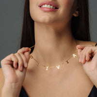 Thumbnail for Woman wearing a Classic Name Necklace with personalized letters, showcasing the elegance of Brother & Sisters jewelry.