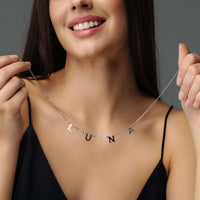 Thumbnail for Woman wearing Classic Name Necklace with letters LUNA, showcasing personalized jewelry from Brother & Sisters.