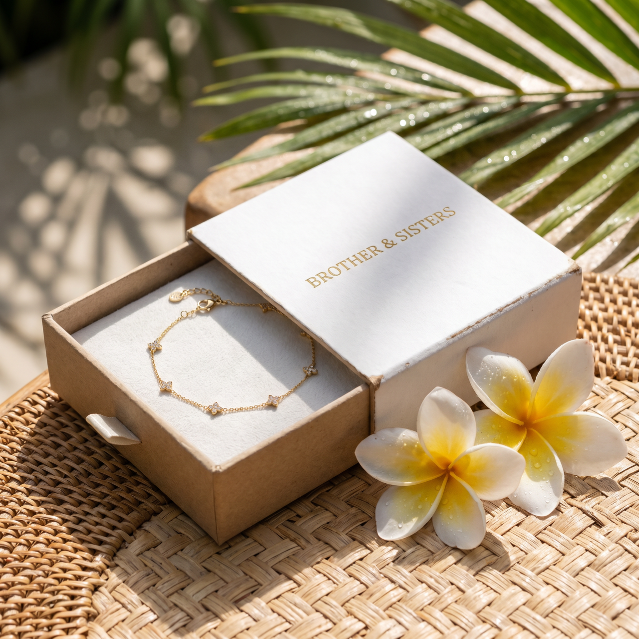 Clover Charm Anklet in Brother & Sisters gift box on beach