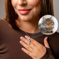 Thumbnail for Close-up of a woman wearing a Cross Photo Necklace, featuring a cat's photo projection, by Brother & Sisters.