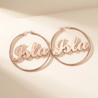 Thumbnail for Custom Name Hoop Earrings in Rose Gold, studio packshot of the pair on a plain background | SKU: name-hoop-rose-gold-30-mm