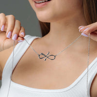 Thumbnail for Woman wearing an Arrow Name Necklace by Brother & Sisters, showcasing elegant personalized design with an arrow detail.