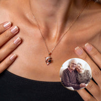 Thumbnail for Dolphin Photo Necklace worn by a woman, featuring a custom photo of a couple, by Brother & Sisters.