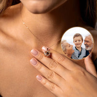 Thumbnail for Double Heart Photo Necklace worn by a woman, showcasing a hidden photo projection feature by Brother & Sisters.