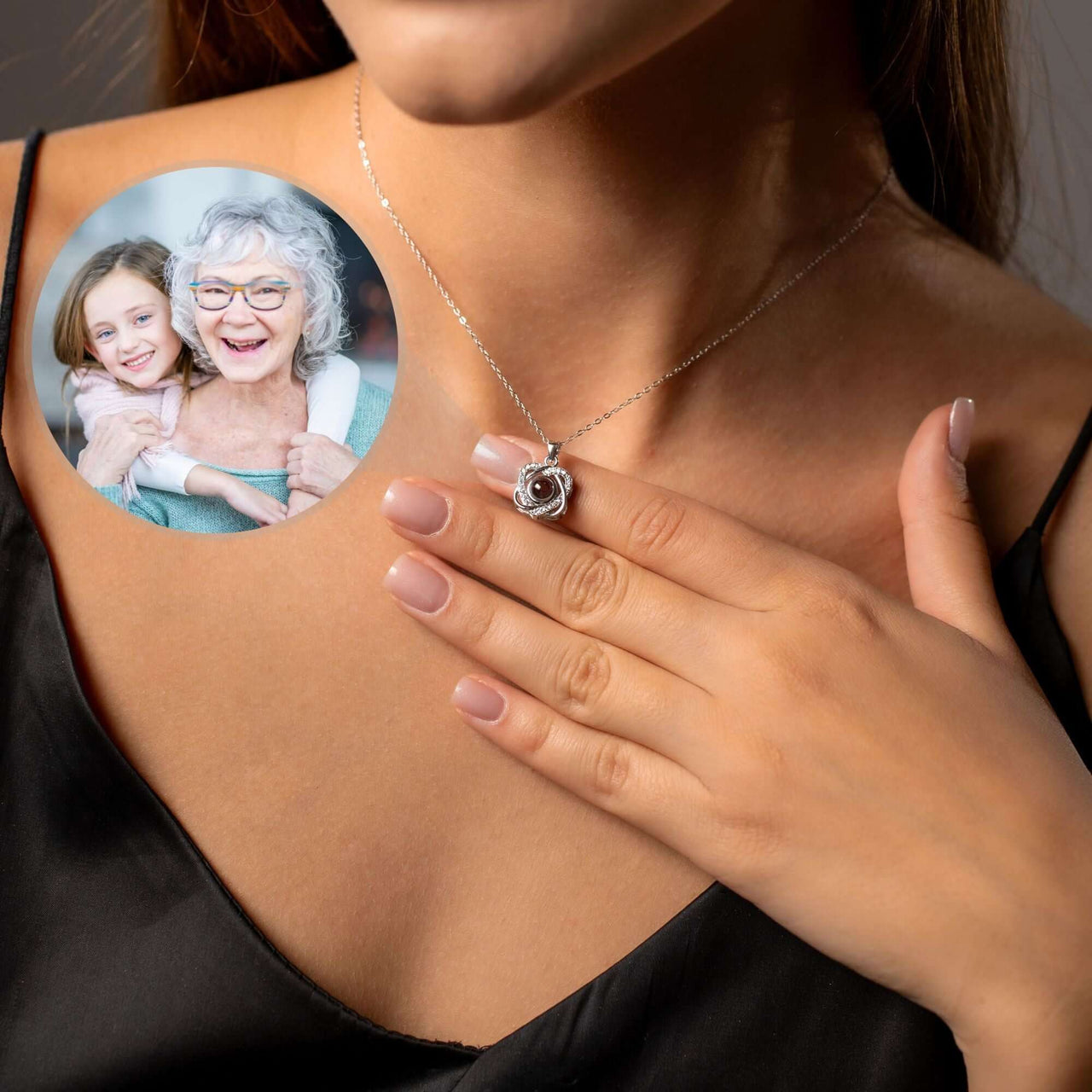 Double Heart Photo Necklace featuring a woman wearing the necklace while showcasing a personalized photo projection.