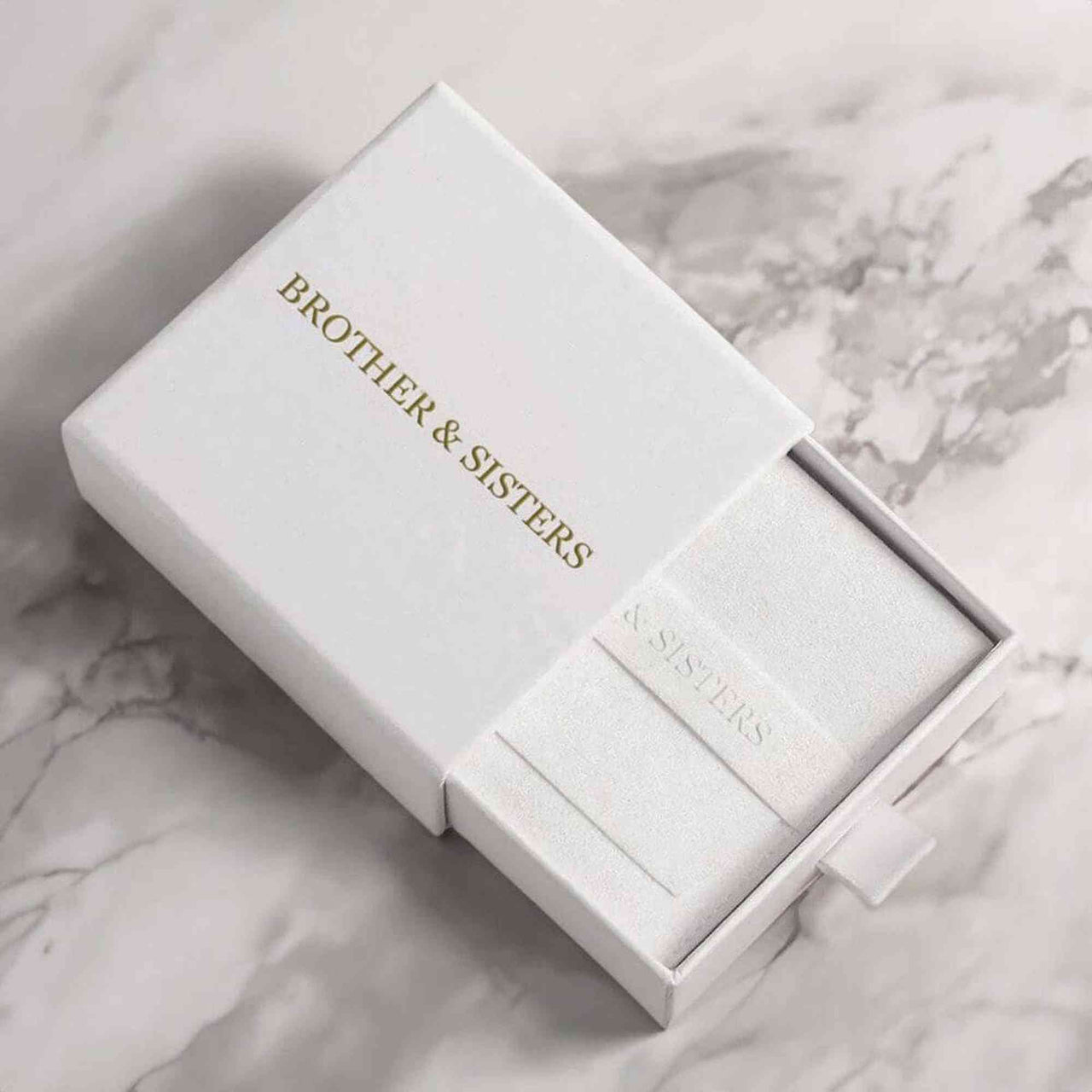 Brother & Sisters gift box for the Circular Photo Necklace, elegant white packaging with gold lettering.