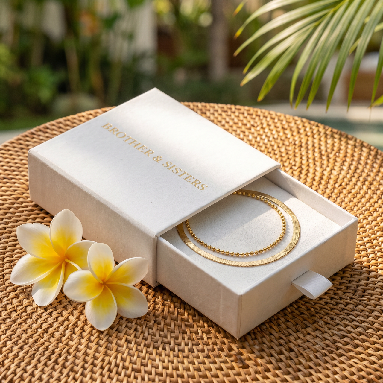 Double Snake Anklet Set in Brother & Sisters gift box on beach